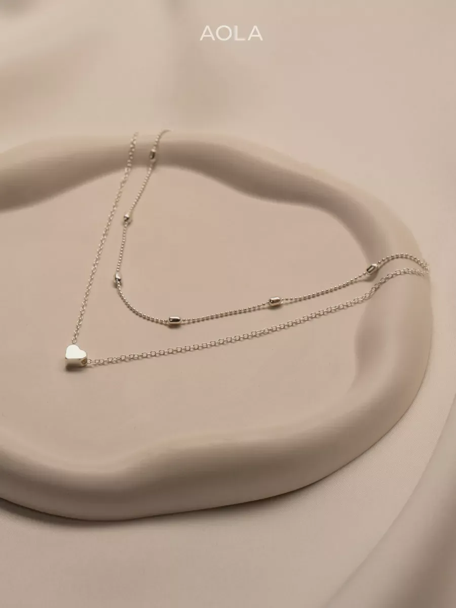 Women's neck chain in silver with a heart